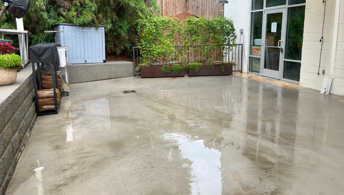 A commercial patio area following a pressure wash and exterior maintenance by Terra Pro-Wash.