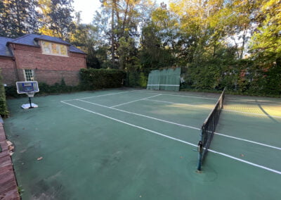 A tennis court at a residential home in Buckhead prior to being pressure washed.